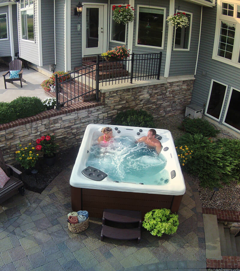 Backyard hot tub installation close to the home